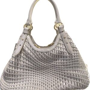 Cole Haan. Stylish White Shoulder Bag with Woven Texture and Gold Hardware